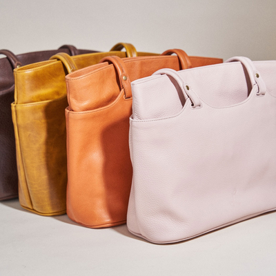 Row of Four Beautiful Leather Bags Designed by Lund Leather